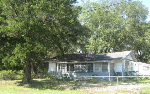 86375 Felmor Road Yulee, FL 32097 - Photo 1 of 1 a front view of a house with a garden