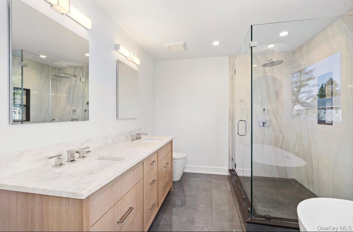 320 Circle Road Muttontown, NY 11791 - Photo 11 of 17 a bathroom with a sink a toilet and shower