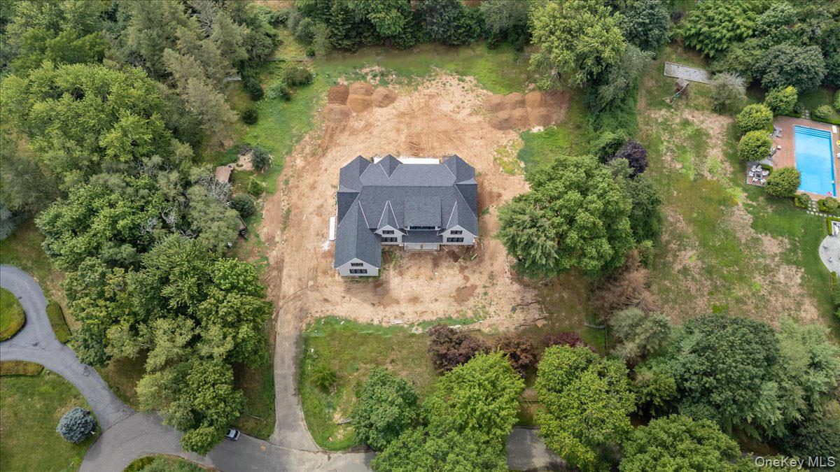 320 Circle Road Muttontown, NY 11791 - Photo 13 of 17 an aerial view of a house with a yard lake and outdoor seating