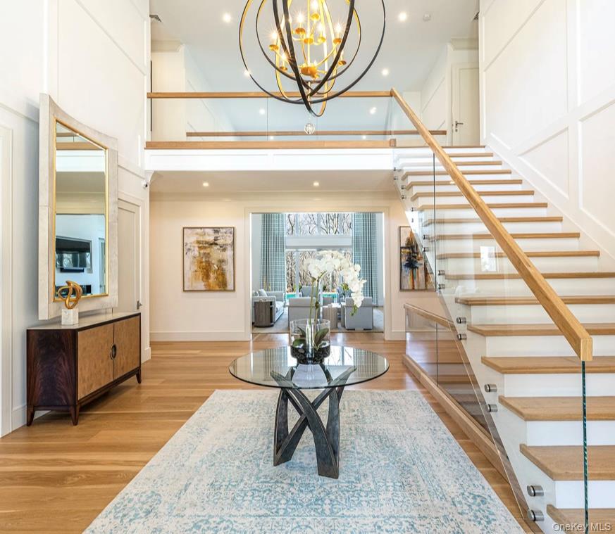 320 Circle Road Muttontown, NY 11791 - Photo 6 of 17 a living room with furniture a rug and wall paintings
