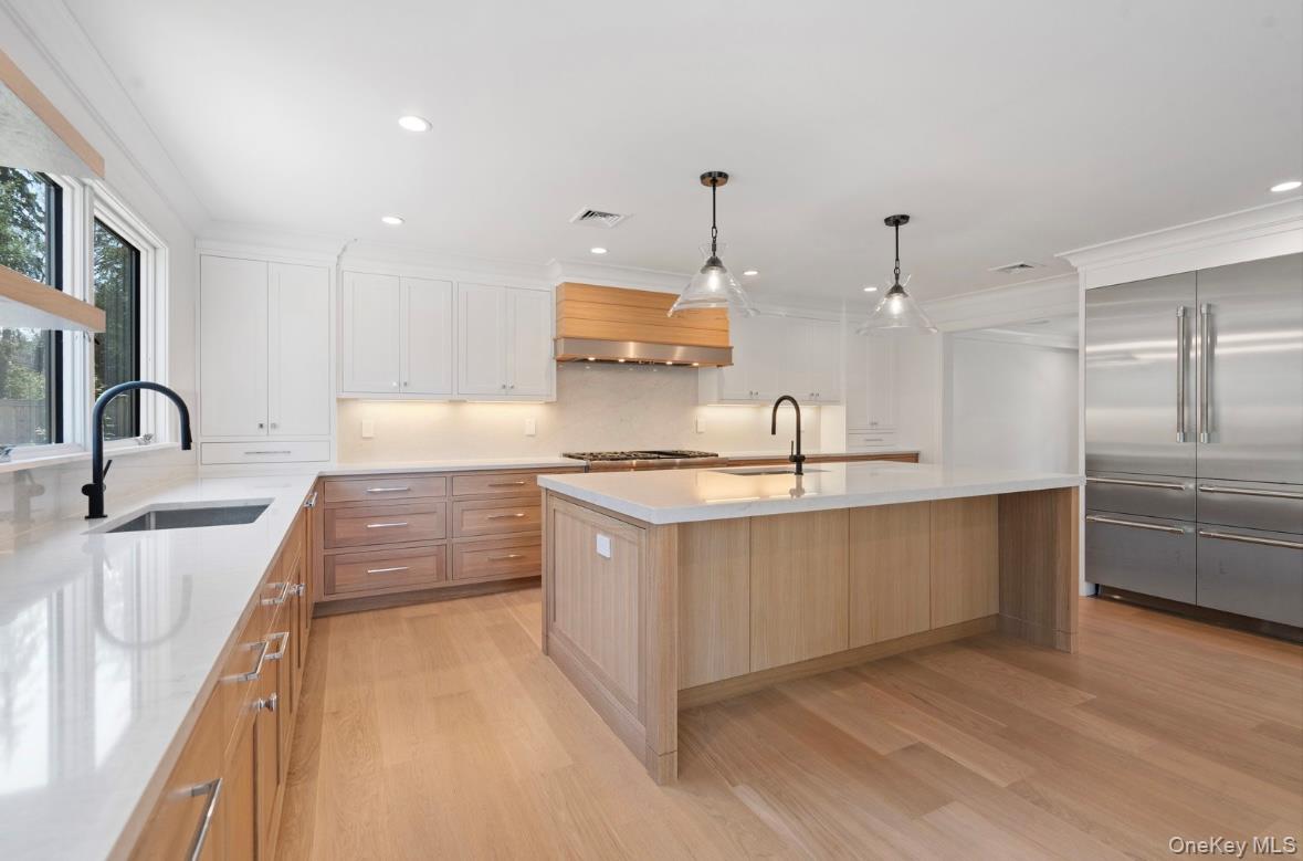 320 Circle Road Muttontown, NY 11791 - Photo 9 of 17 a large kitchen with kitchen island a sink stainless steel appliances and cabinets
