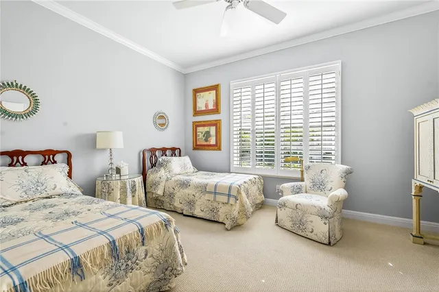 a bedroom with two beds and a couch