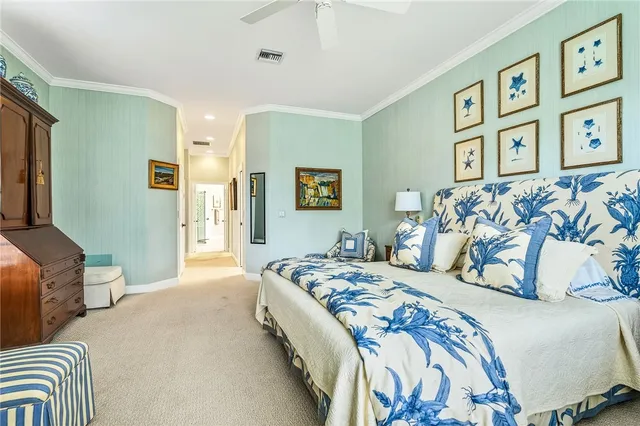 a bedroom with bed and wall painting