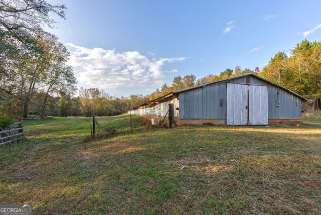 a aerial view of a house with a yard