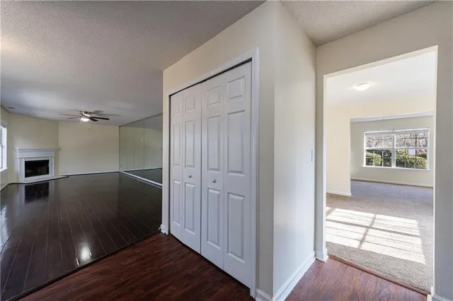 a view of a hallway view with wooden floor and staircase