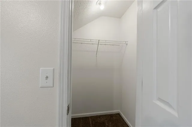 a spacious bathroom with a tub sink and mirror