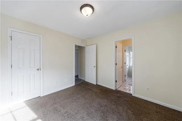 a bathroom with a sink toilet a mirror and window