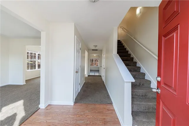a view of a hallway with furniture and entryway
