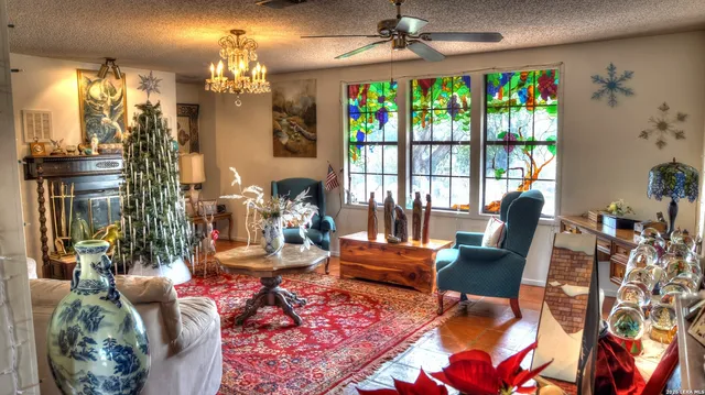 a kitchen with stainless steel appliances granite countertop wooden cabinets a sink and a stove