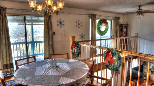 a bedroom with a bed and a table with potted plants