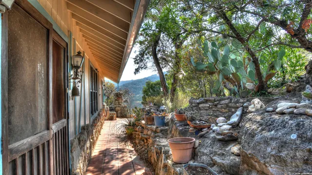 a view of balcony with wooden floor and outdoor seating