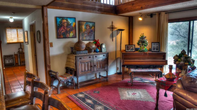 a green field with lots of trees