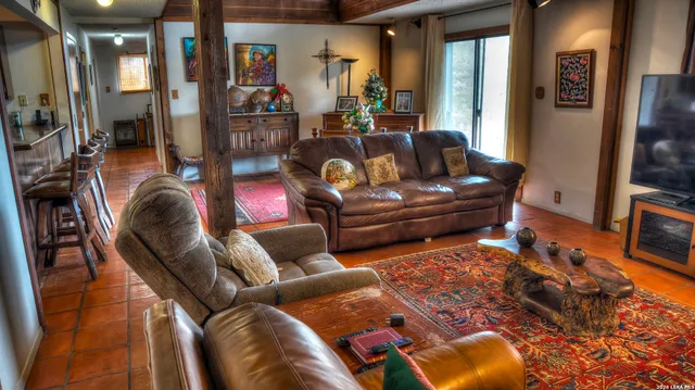 a backyard of a house with yard and outdoor seating