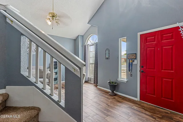 a view of entryway and hall with wooden floor