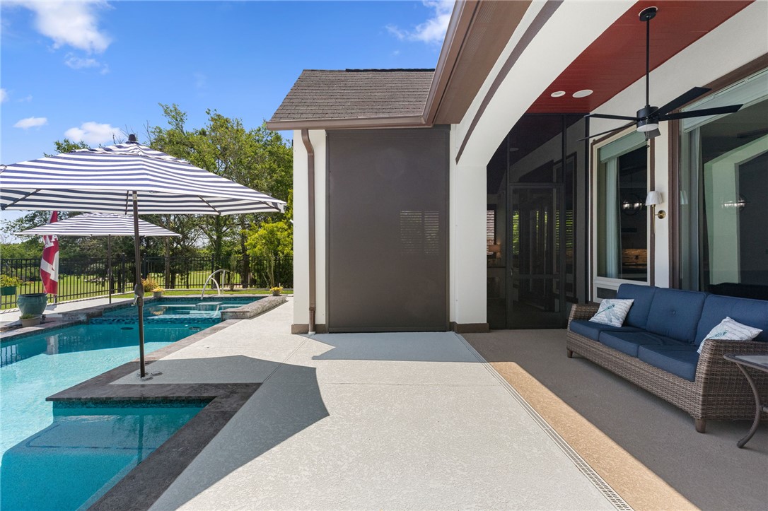 2833 Persimmon Ridge Court Bryan, TX 77807 - Photo 50 of 50 a view of a patio with a table and chairs