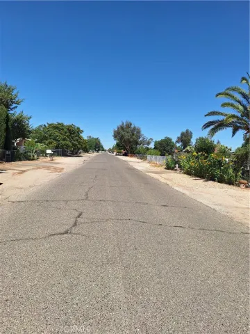 a view of a road with a building in the background