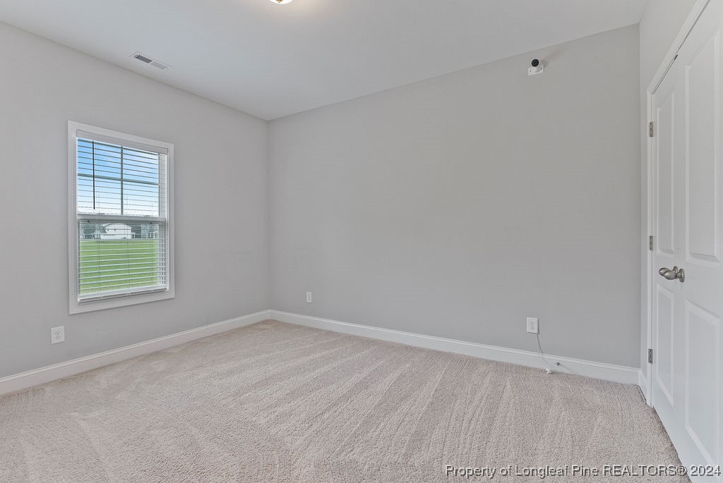 7751 Rufus Johnson Road Fayetteville, NC 28306 - Photo 17 of 21 a view of an empty room with a window