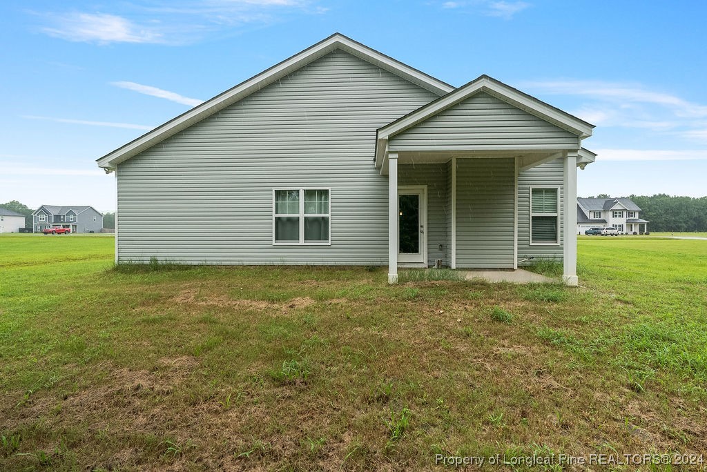 7751 Rufus Johnson Road Fayetteville, NC 28306 - Photo 21 of 21 a view of a house with a yard