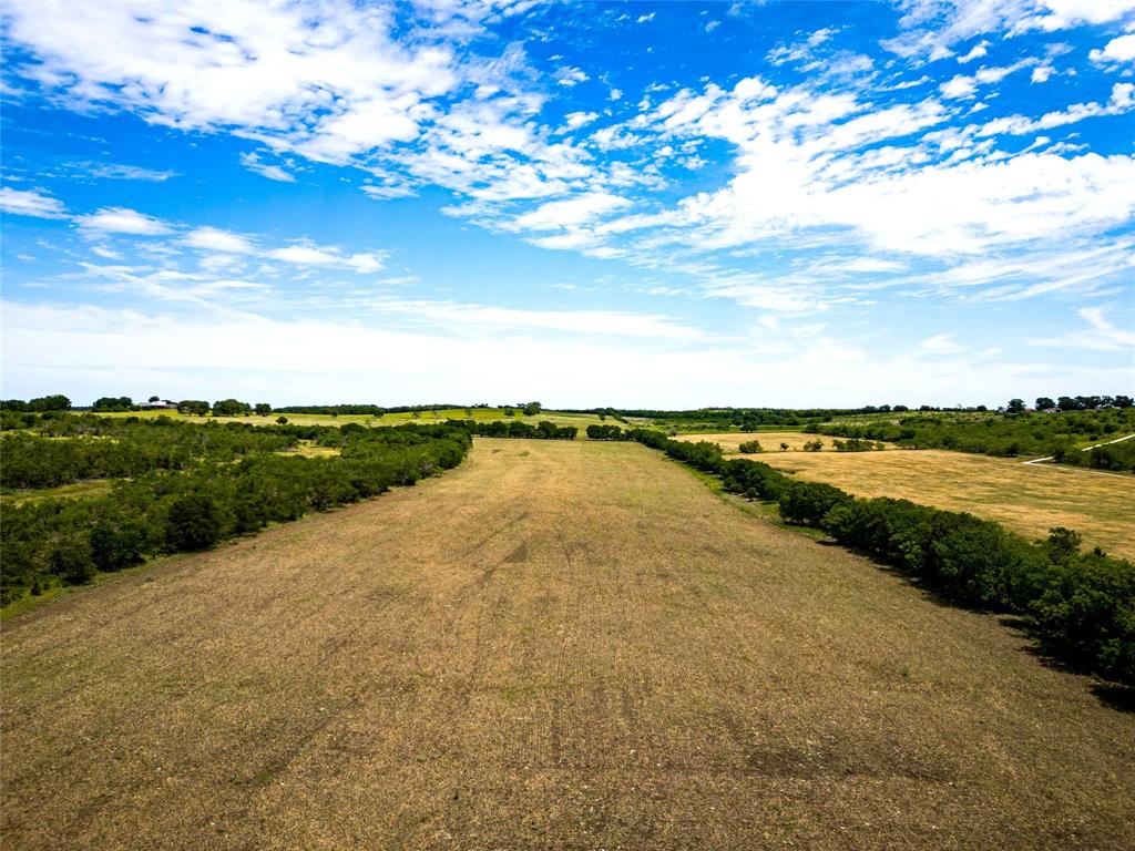 46.5-ac Alexander Road Moody, TX 76557 - Photo 23 of 27 a view of a lake with houses in the back