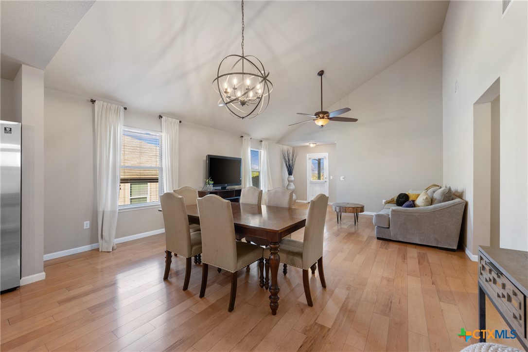 117 Liard River Road Hutto, TX 78634 - Photo 13 of 48 a view of a dining room with furniture window and wooden floor