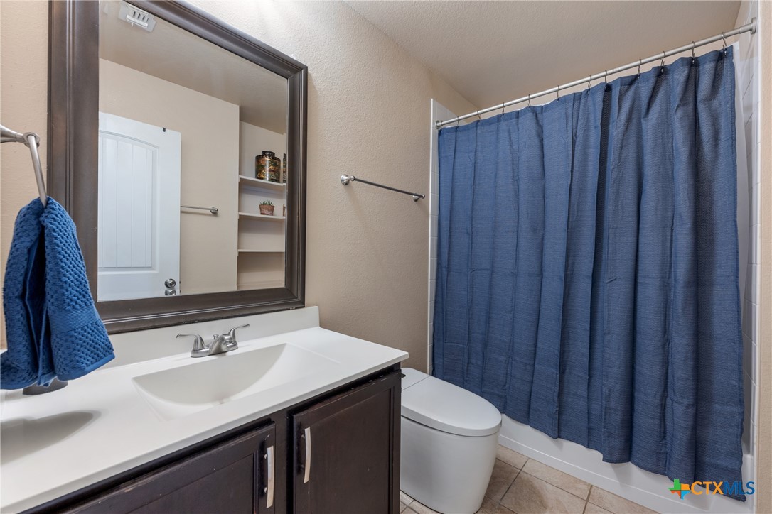 117 Liard River Road Hutto, TX 78634 - Photo 33 of 48 a bathroom with a sink and a toilet