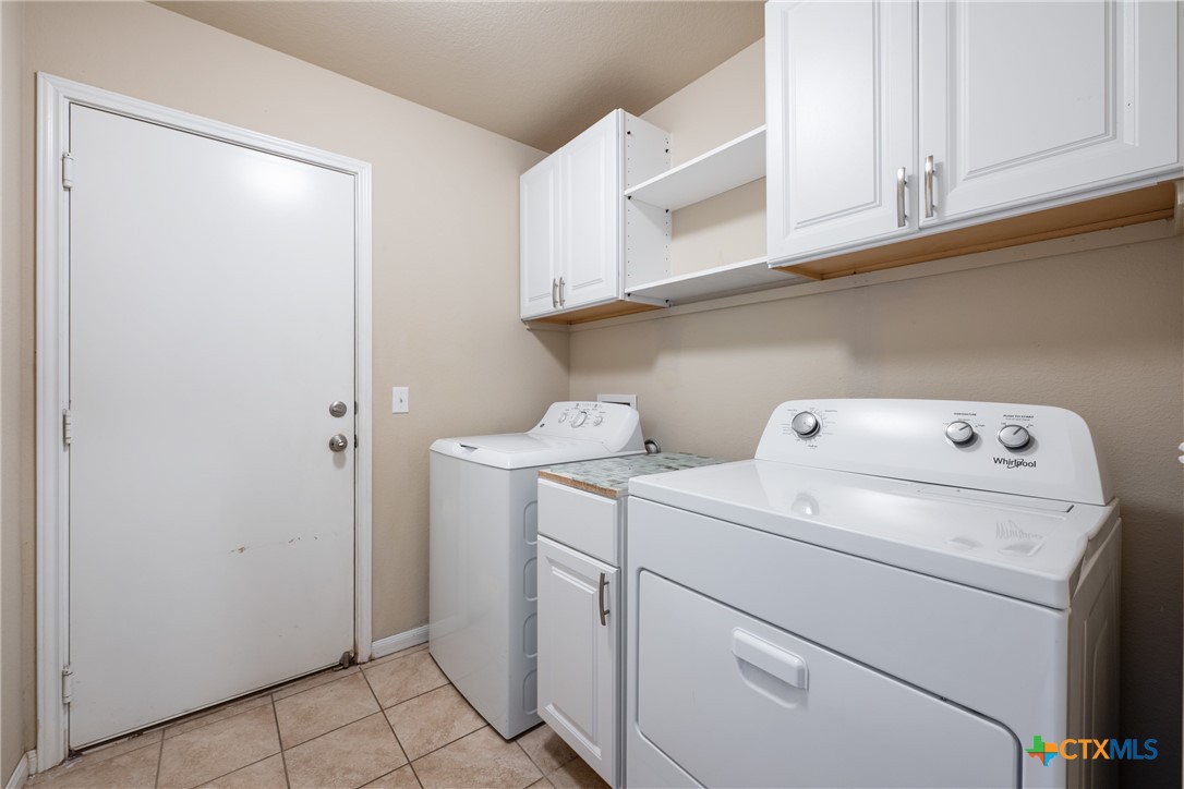 117 Liard River Road Hutto, TX 78634 - Photo 34 of 48 a utility room with dryer and washer