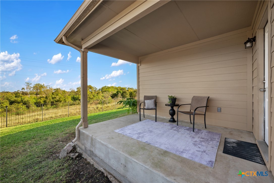 117 Liard River Road Hutto, TX 78634 - Photo 38 of 48 a view of a backyard with table and chair