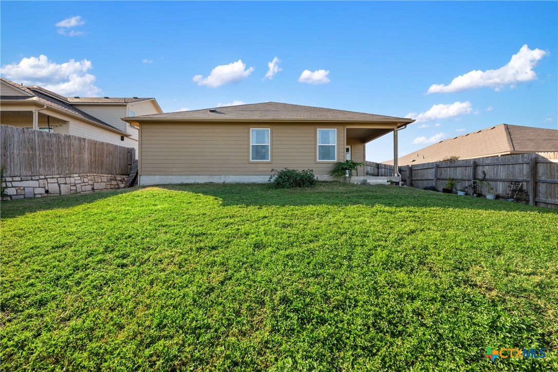 117 Liard River Road Hutto, TX 78634 - Photo 40 of 48 a view of a house with a back yard