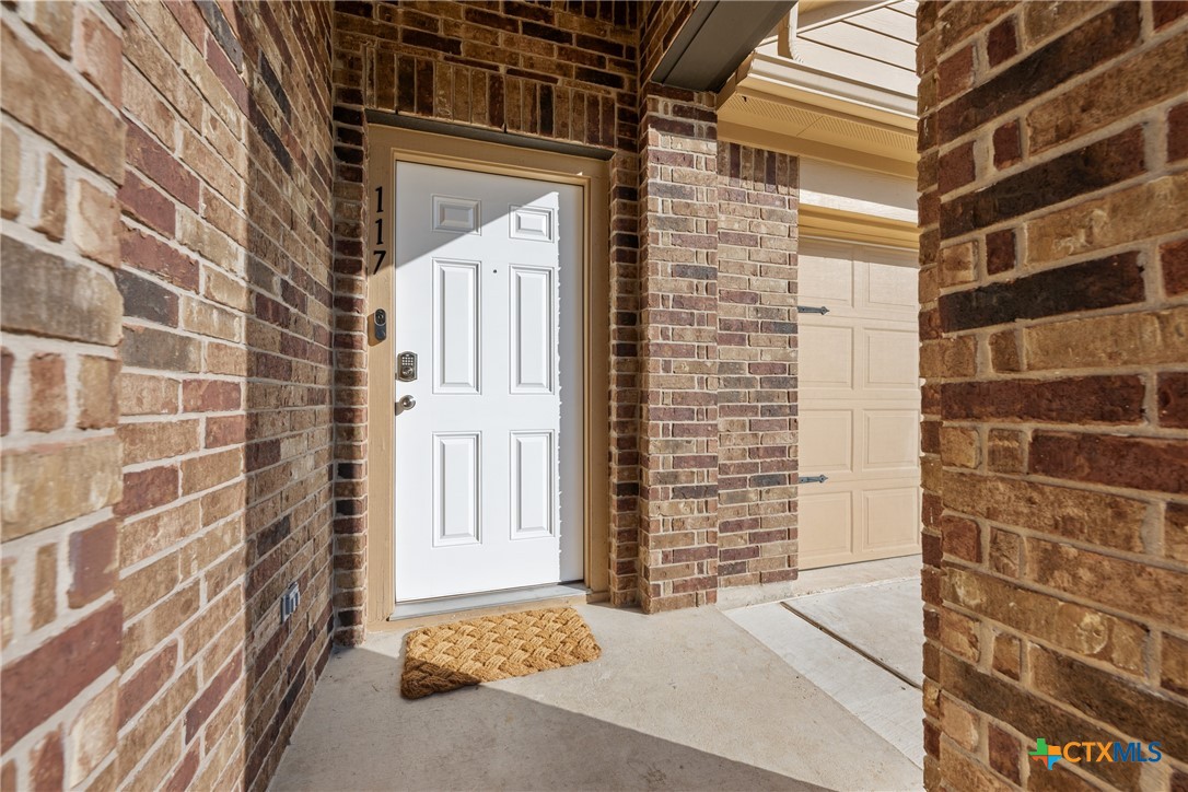 117 Liard River Road Hutto, TX 78634 - Photo 5 of 48 a view of a brick building