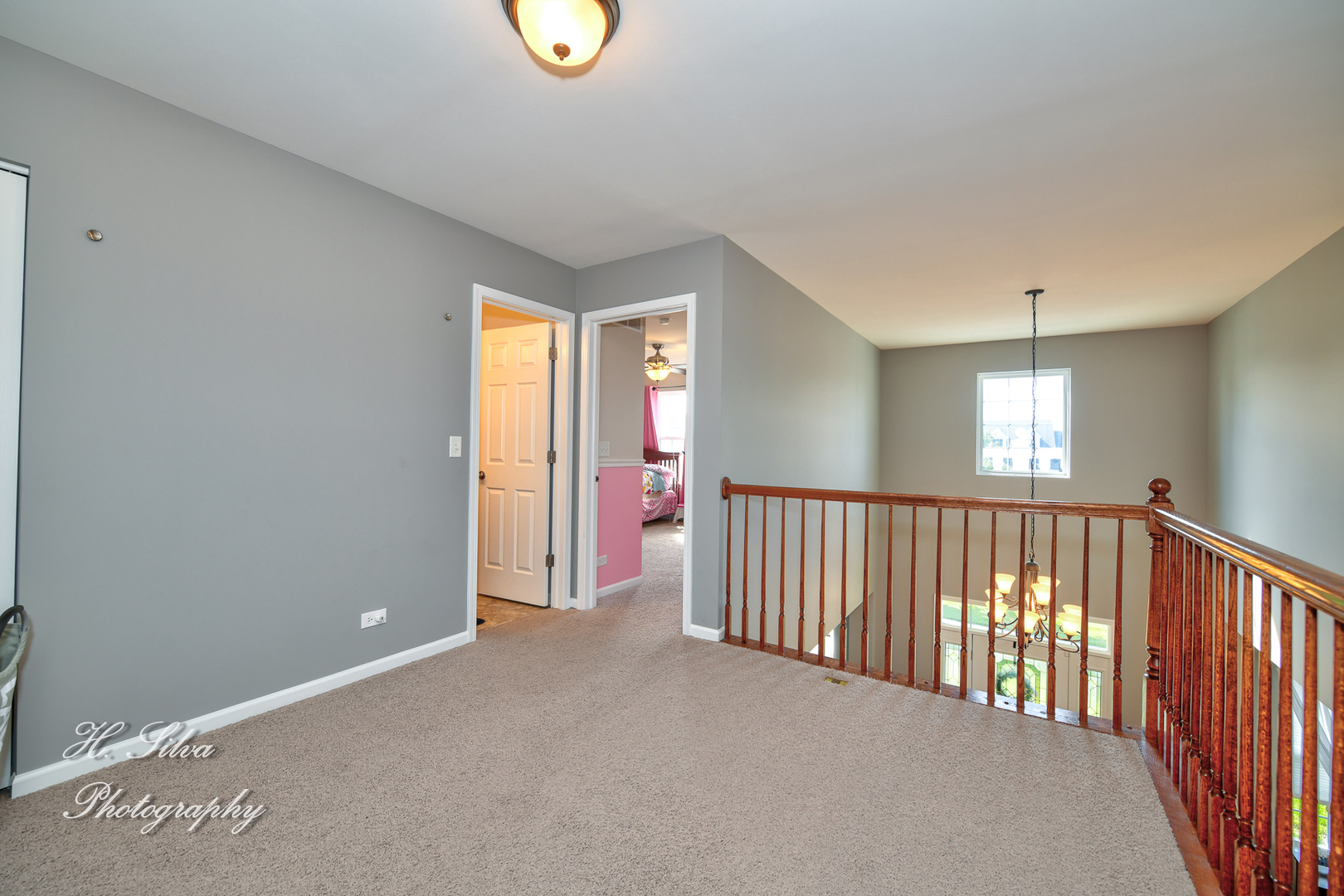 249 Sonora Drive Elgin, IL 60124 - Photo 17 of 42 a view of a hallway to an empty room with a window