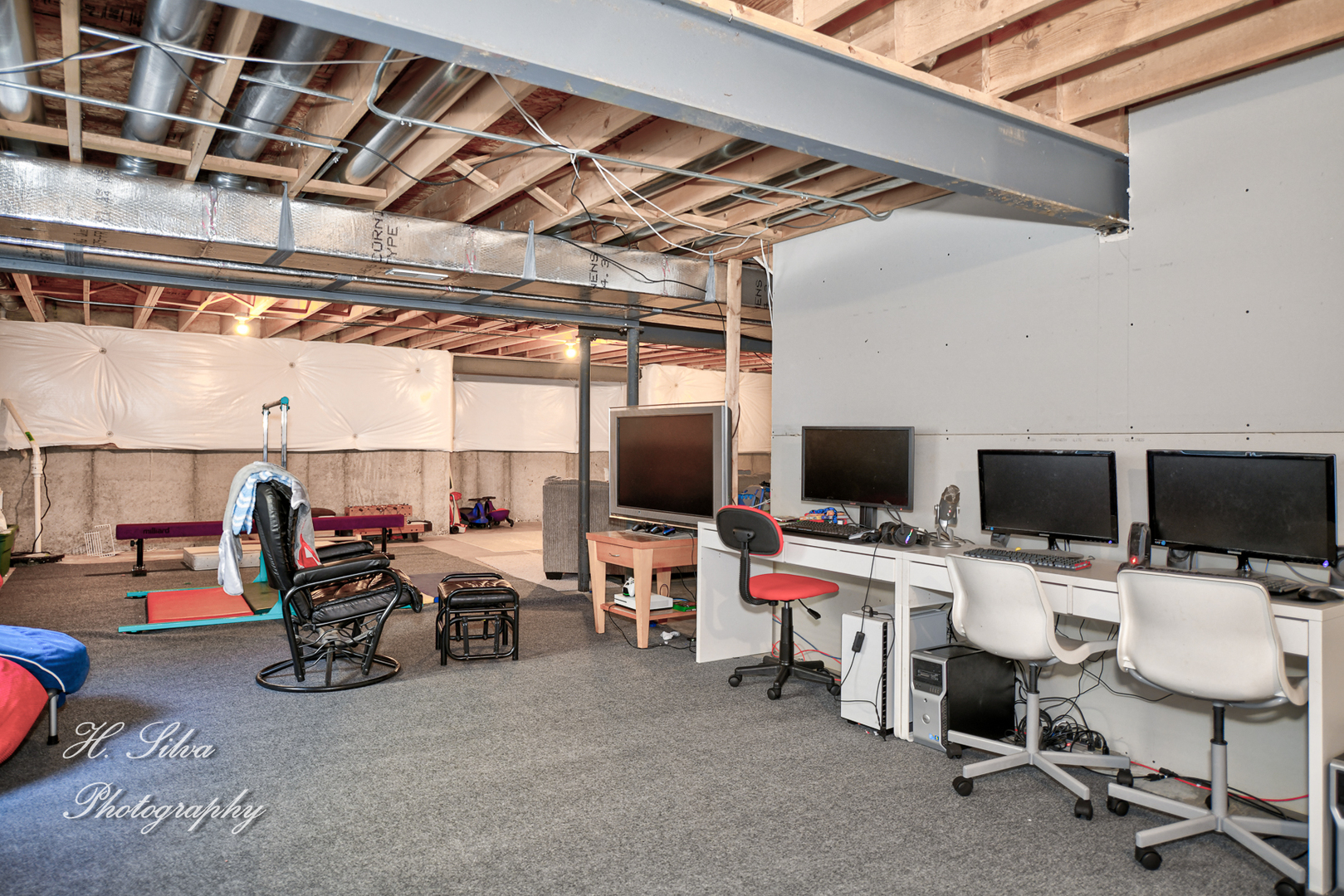 249 Sonora Drive Elgin, IL 60124 - Photo 31 of 42 a room with gym equipment and a flat screen tv