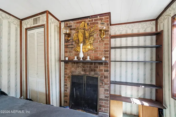 a living room with furniture and a window with outer view