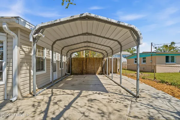 an aerial view of a houses with swimming pool