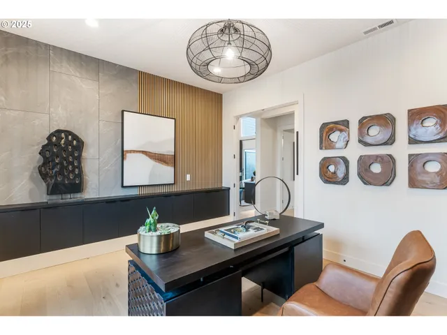 a bathroom with a sink a light fixture and a mirror