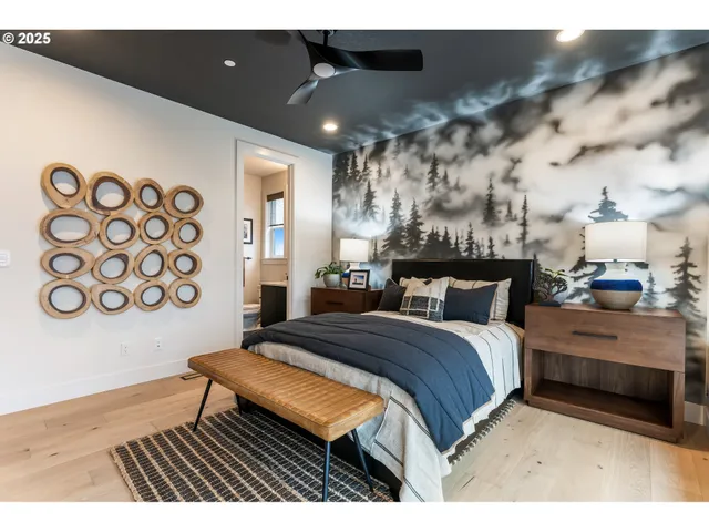 a bathroom with a sink mirror and toilet