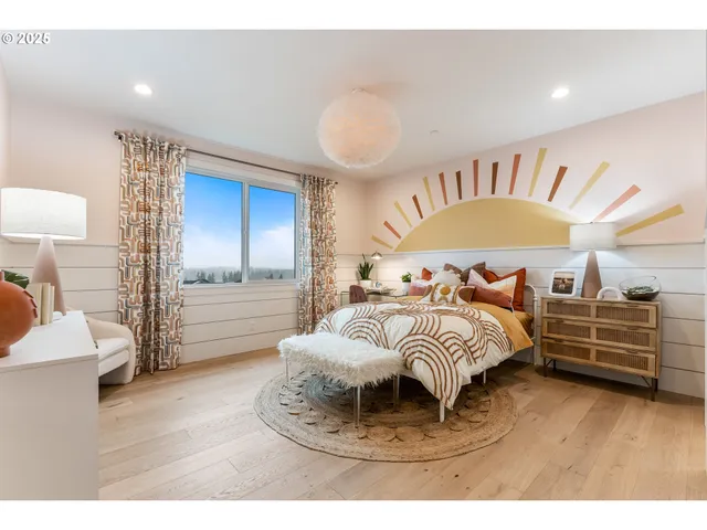 a bedroom with a bed and a painting