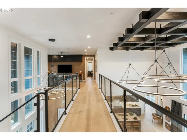 a living room with stainless steel appliances kitchen island furniture and a view of kitchen