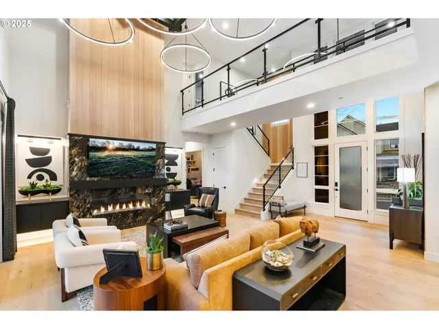 a kitchen with kitchen island granite countertop a sink cabinets and stainless steel appliances