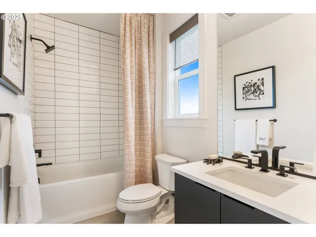 a living room with furniture ceiling fan and a rug