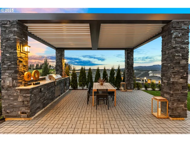 a view of a patio with table and chairs with wooden floor and fence