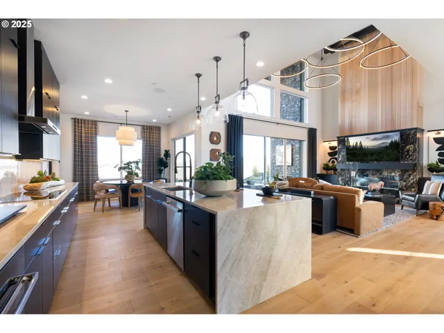 a kitchen with stainless steel appliances kitchen island granite countertop a sink and cabinets