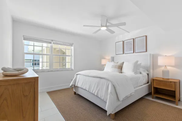 a view of house with swimming pool and outdoor seating