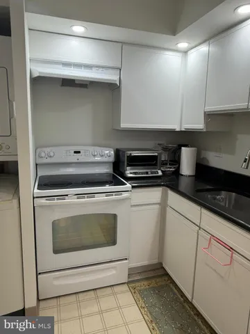 a kitchen with a stove and a sink