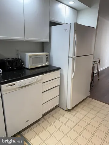 a kitchen with appliances and cabinets