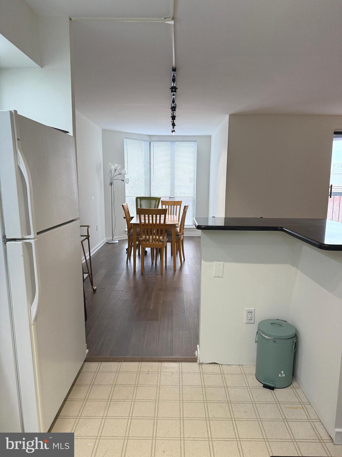 200 Lombard Street, Unit 625 Philadelphia, PA 19147 - Photo 15 of 38 a view of a kitchen with fridge and wooden floor