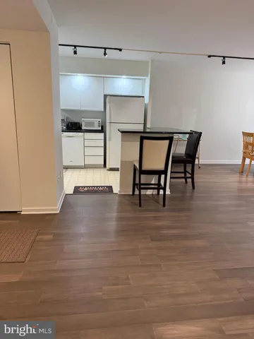 a view of kitchen with furniture and wooden floor