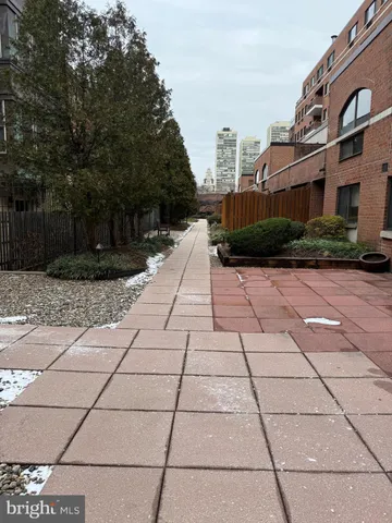 a view of a pathway with a house