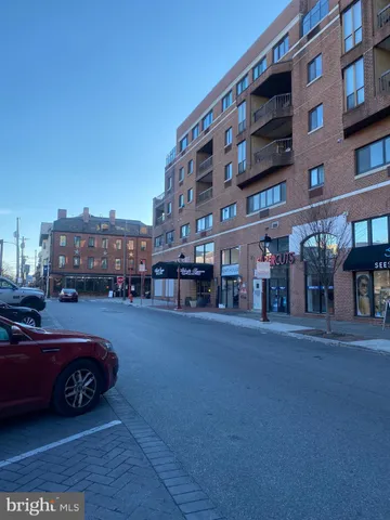 a view of street with parked cars