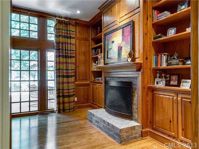 2726 Sharon Road Charlotte, NC 28211 - Photo 5 of 16 a living room with hard wood floors and a fireplace