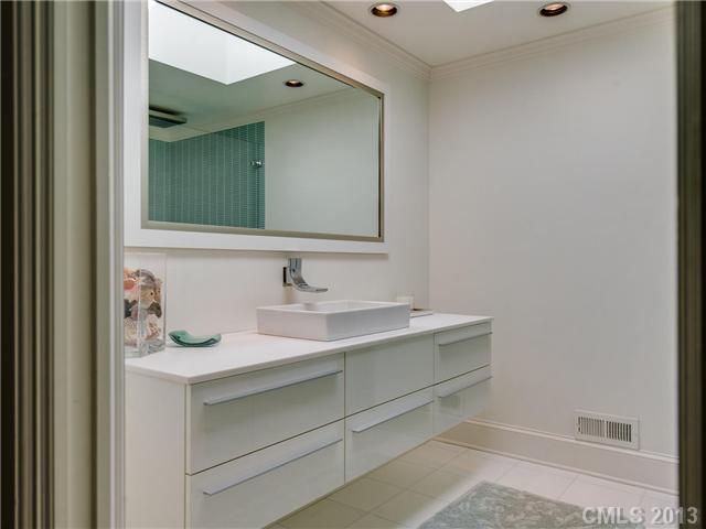 2726 Sharon Road Charlotte, NC 28211 - Photo 7 of 16 a bathroom with a sink and a mirror